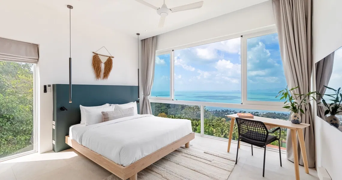 Pacific Palisade Samui luxury villa - bedroom and a desk with sea view